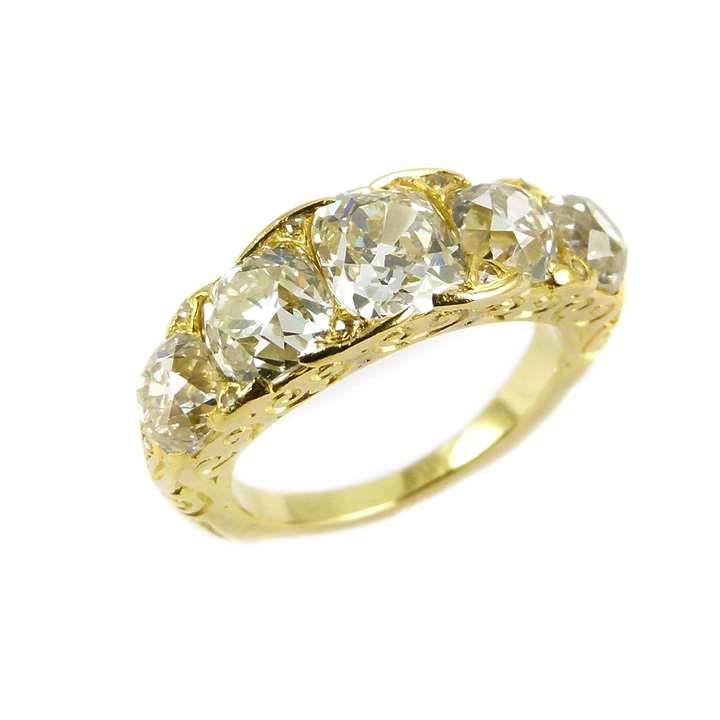Graduated five stone cushion cut diamond ring